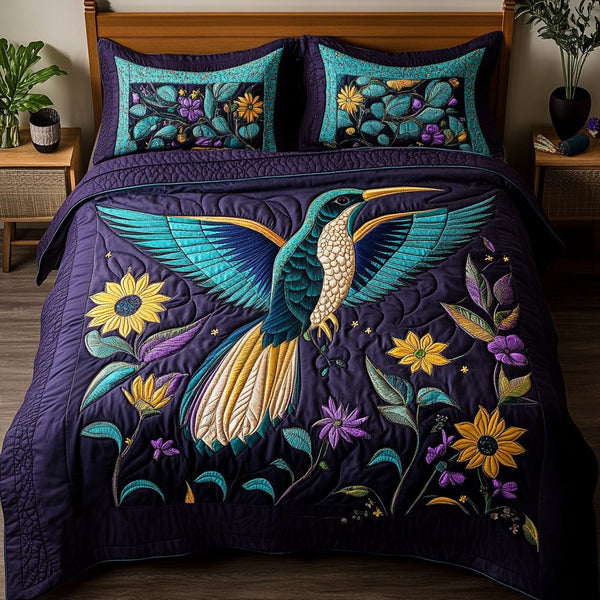 Floral Flight quilted 3-piece bedding set on a made bed with two matching pillow shams