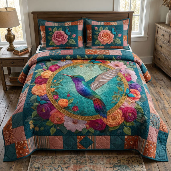 Floral Hummingbird quilted 3-piece bedding set on a made bed with two matching pillow shams