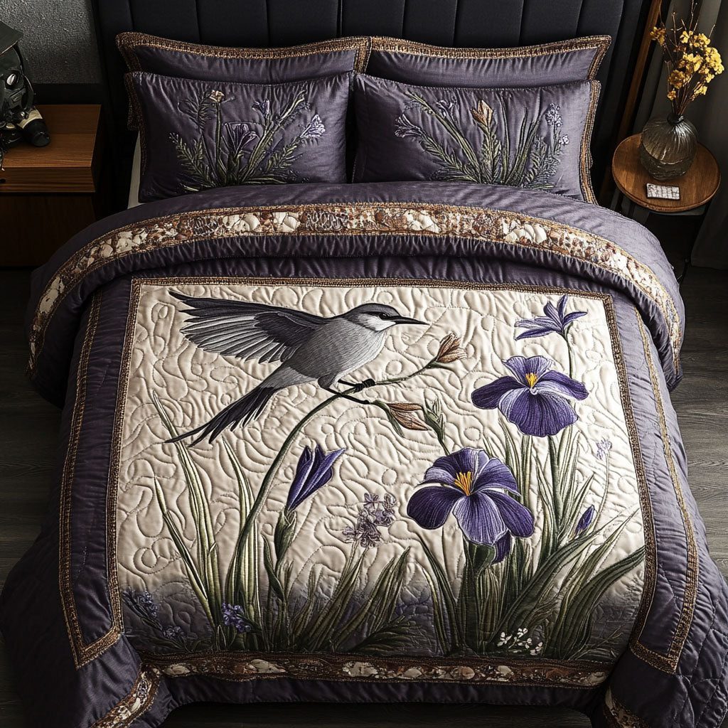 Fluttering Iris quilted 3-piece bedding set on a made bed with two matching pillow shams