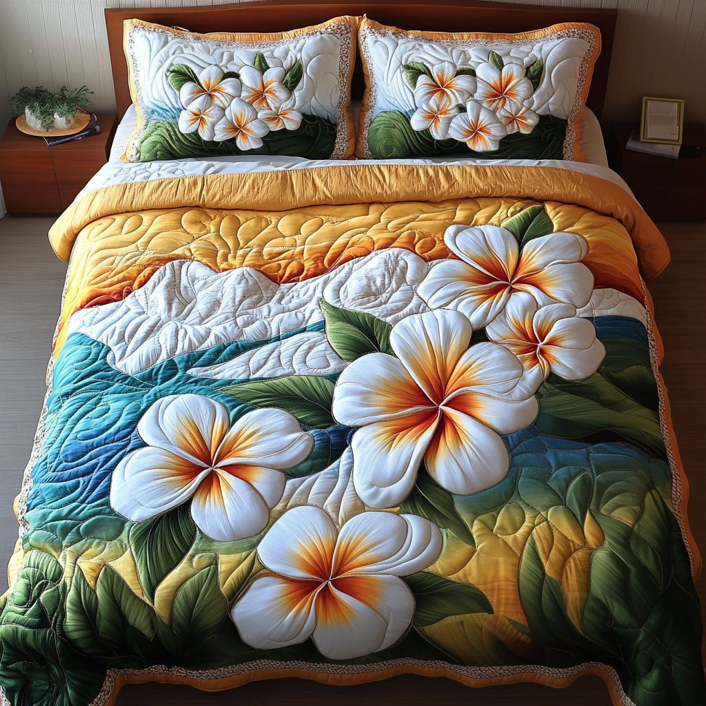 Frangipani Paradise quilted 3-piece bedding set on a made bed with two matching pillow shams