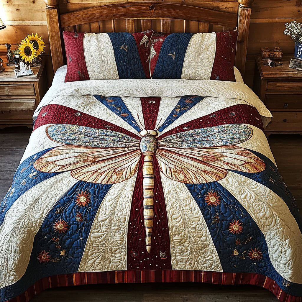 Freedom Flyer quilted 3-piece bedding set on a made bed in a warmly lit bedroom