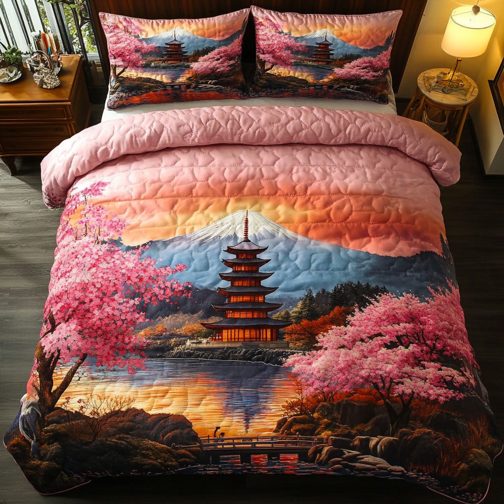 Fuji Sakura Sky quilted 3-piece bedding set on a made bed with two matching pillow shams