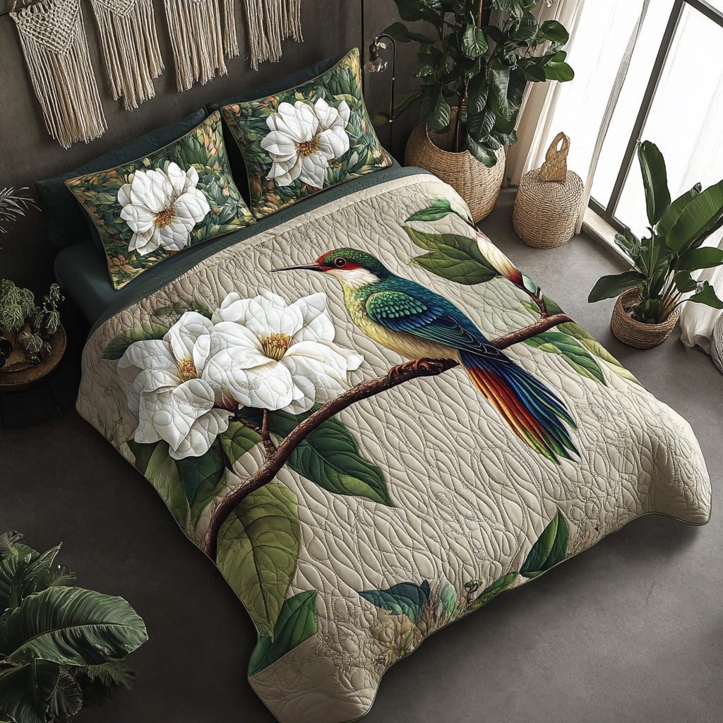 Garden Flit quilted 3-piece bedding set on a made bed with two matching pillow shams