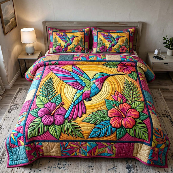 Garden Hummer quilted 3-piece bedding set on a made bed with two matching pillow shams