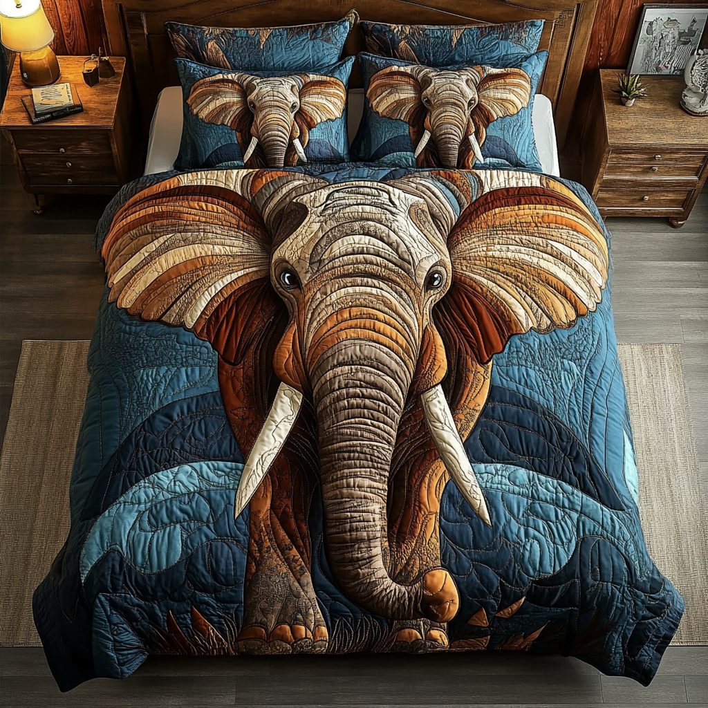 Gentle Elephant quilted 3-piece bedding set on a made bed with two matching pillow shams