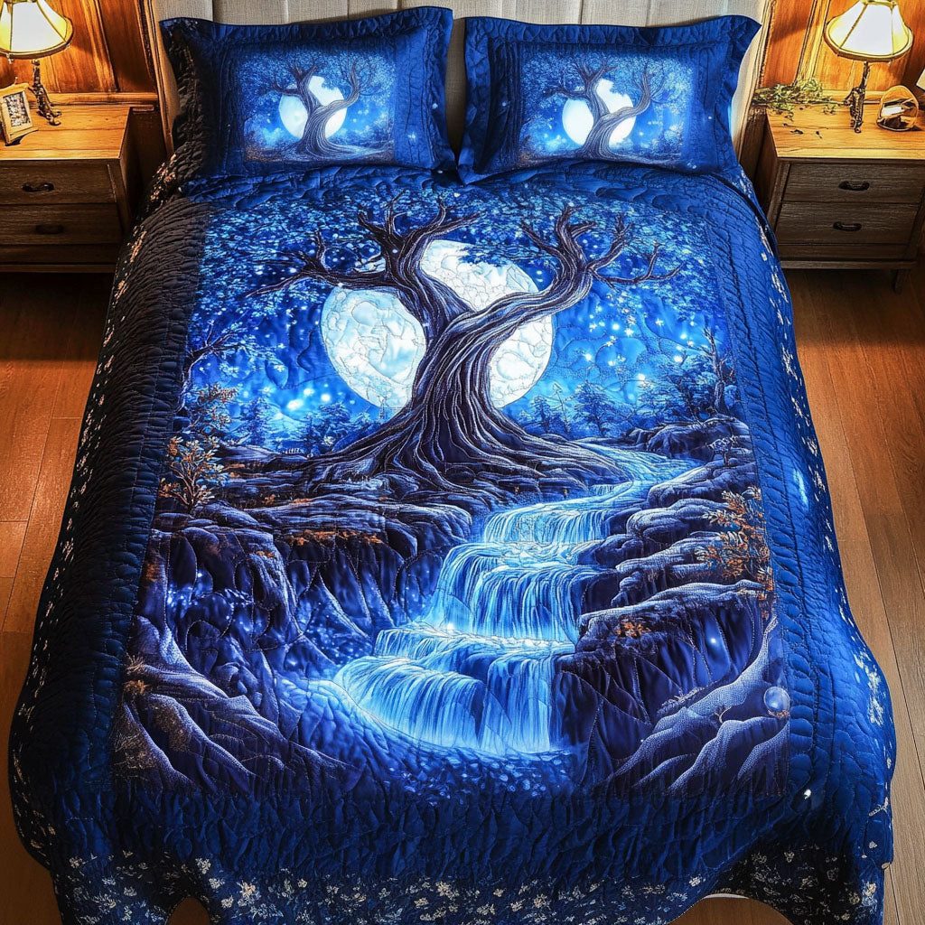 Glowing Moonlit Falls quilted 3-piece bedding set on a made bed with two matching pillow shams