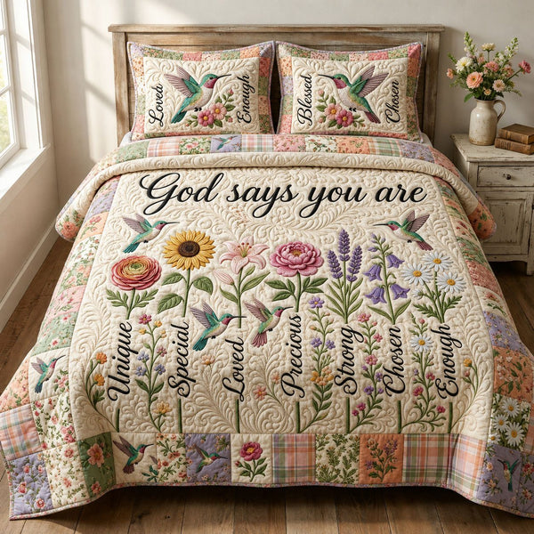 God Says You Are quilted 3-piece bedding set on a made bed in a softly lit bedroom