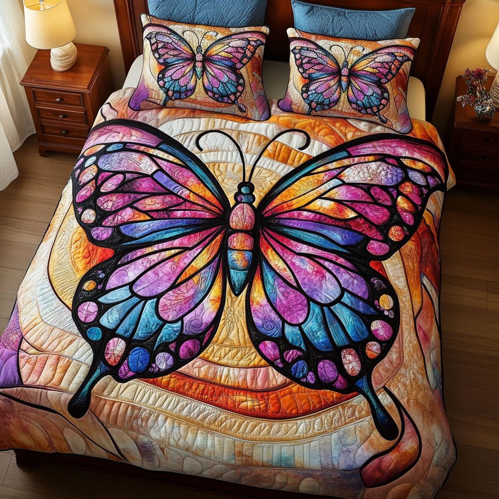 Golden Wings quilted 3-piece bedding set on a made bed with two matching pillow shams