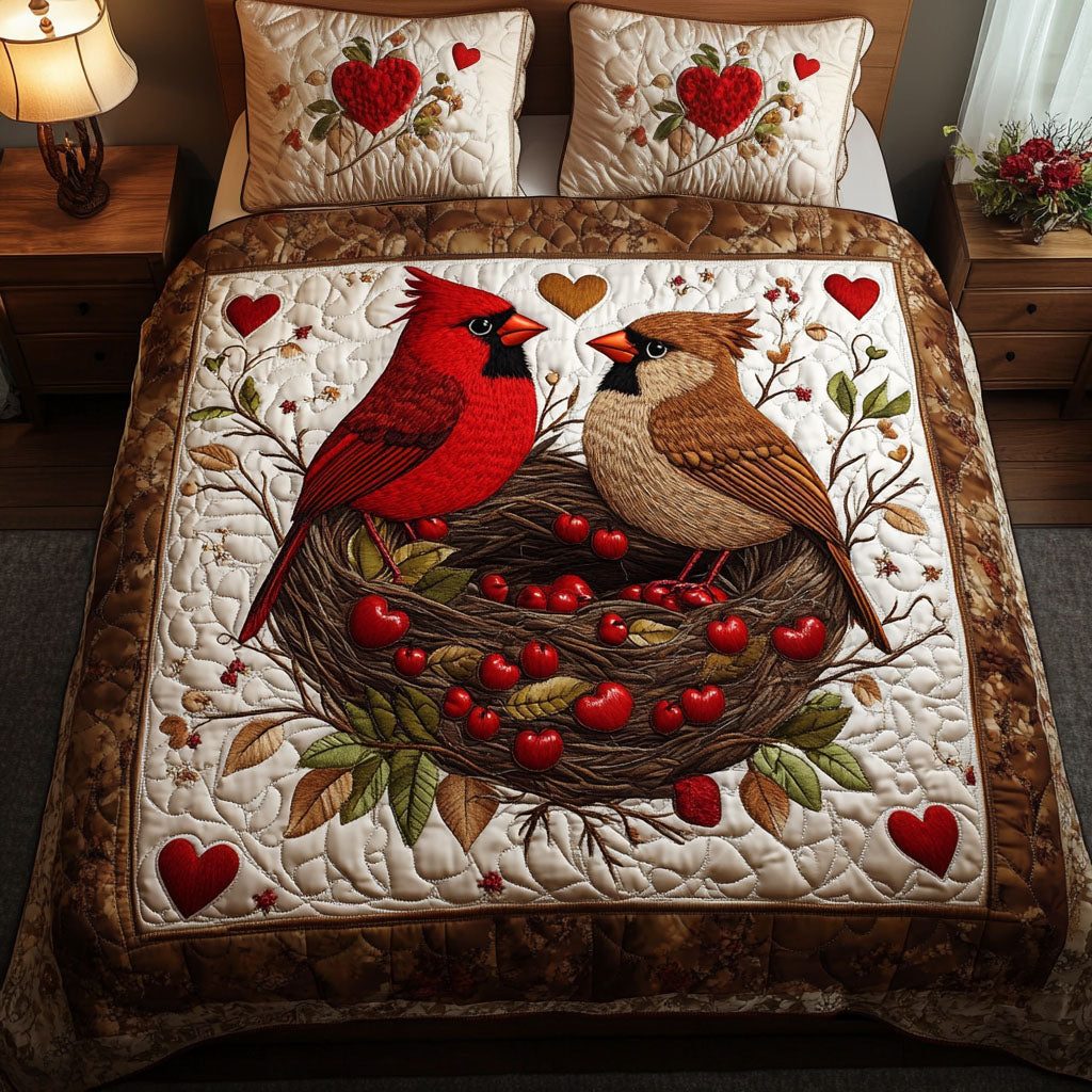 Heartful Cardinal Nest quilted 3-piece bedding set on a made bed with two matching pillow shams