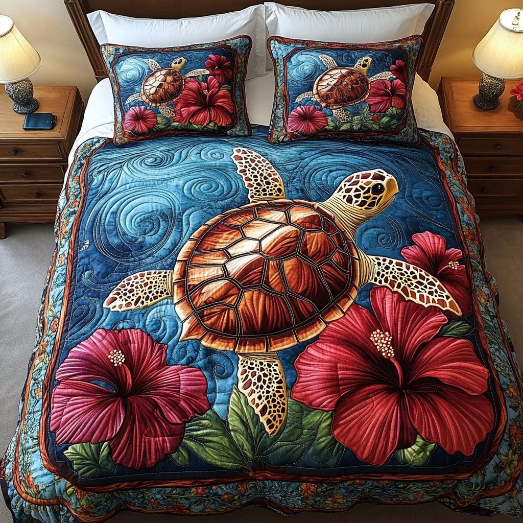Hibiscus Dream quilted 3-piece bedding set on a made bed with two matching pillow shams