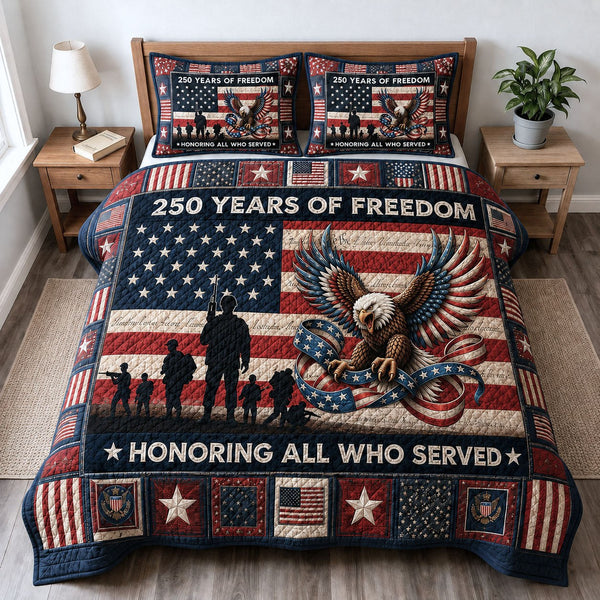 Honoring All Who Served quilted 3-piece bedding set on a made bed with two matching pillow shams