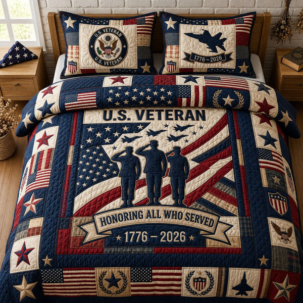 Honoring All Who Served quilted 3-piece bedding set on a made bed with two matching pillow shams