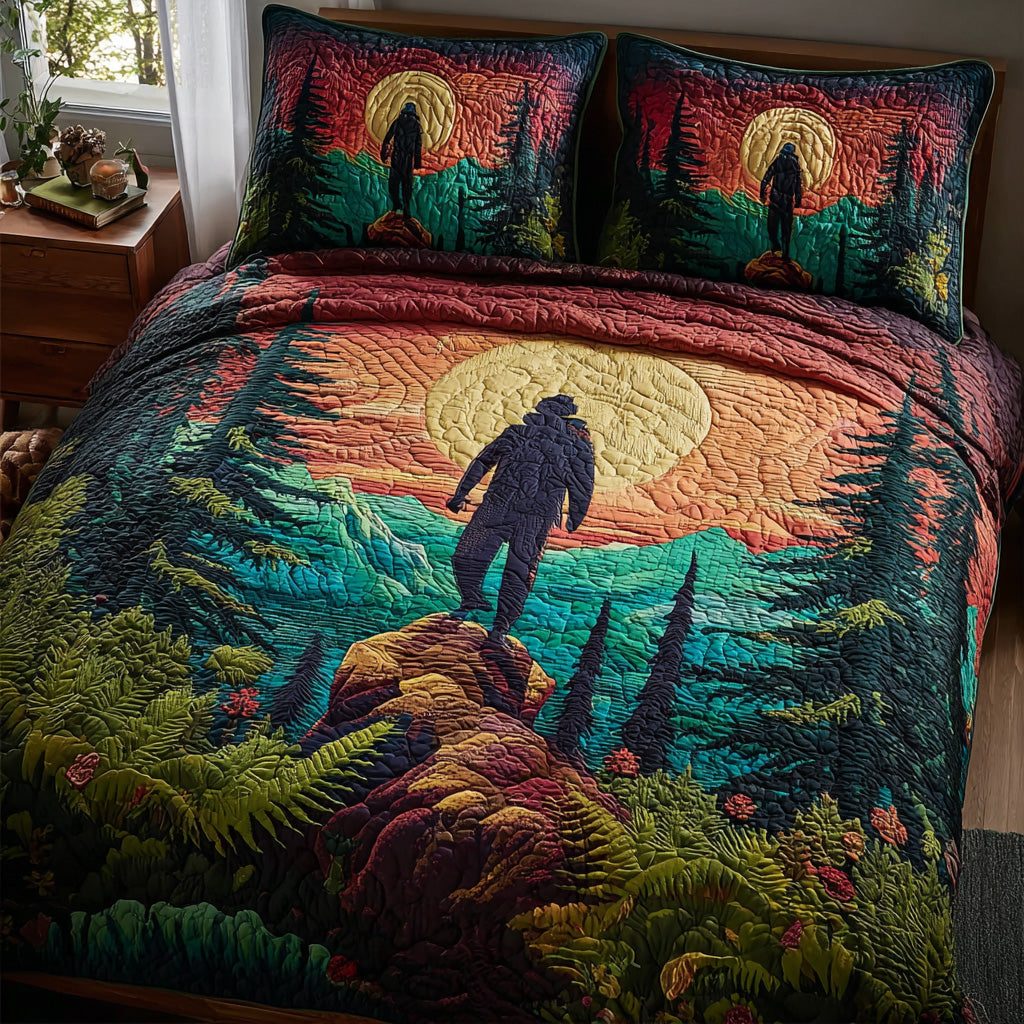 Horizon Hiker quilted 3-piece bedding set on a made bed with two matching pillow shams
