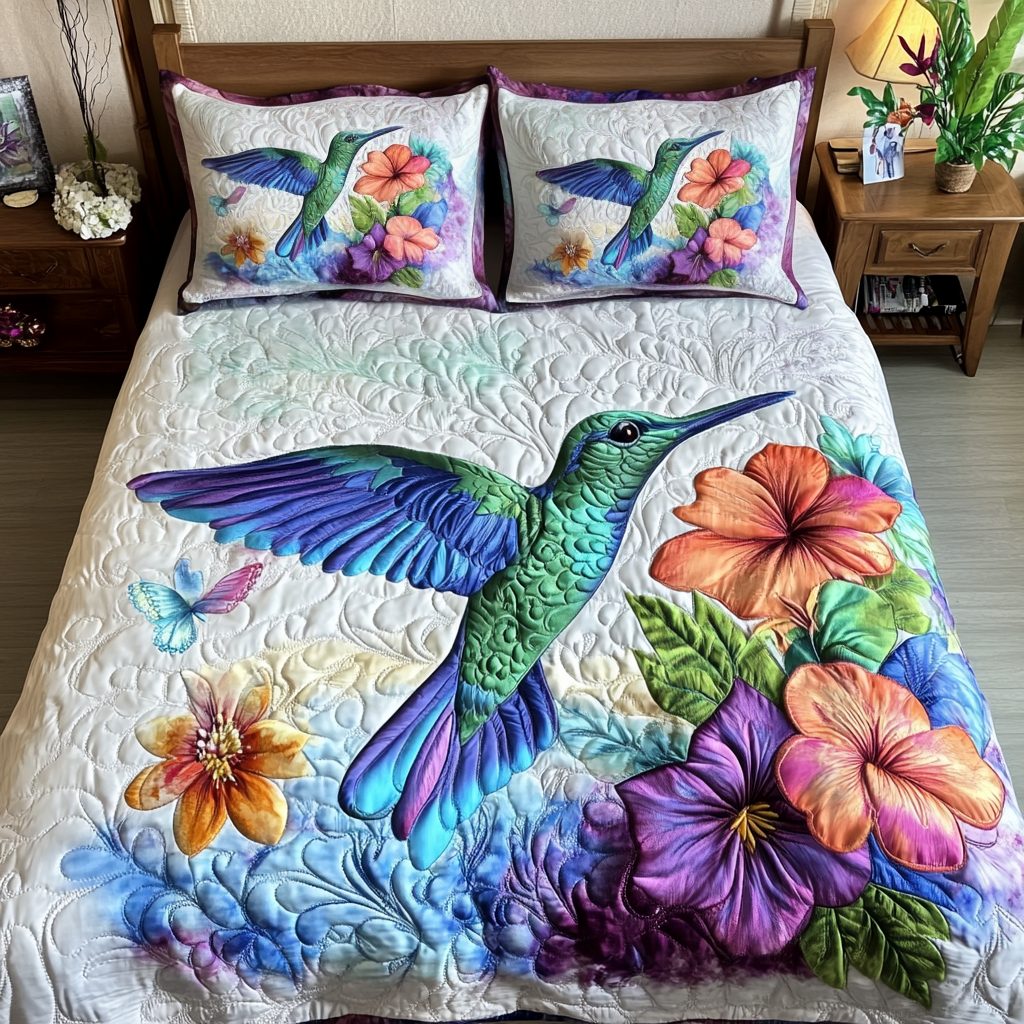 Humming Harmony quilted 3-piece bedding set on a made bed with two matching pillow shams