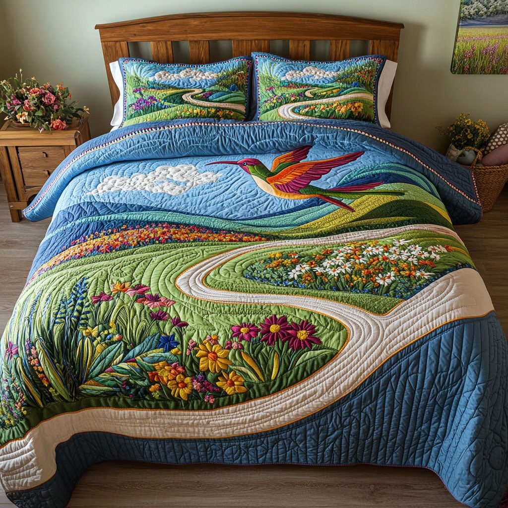 Humming Haven quilted 3-piece bedding set on a made bed with two matching pillow shams