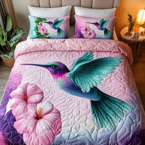 Hummingbird Breeze quilted 3-piece bedding set on a made bed with two matching pillow shams