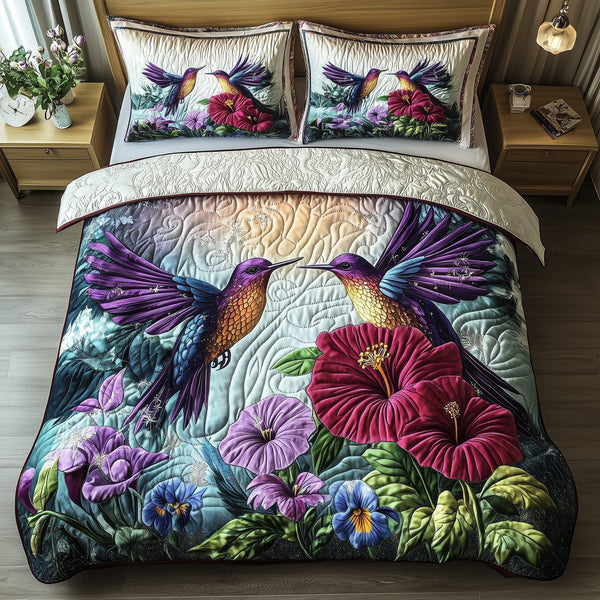 Hummingbird Love quilted 3-piece bedding set on a made bed with two matching pillow shams