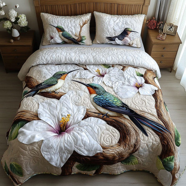 Ivory Whisper Wings quilted 3-piece bedding set on a made bed with two matching pillow shams