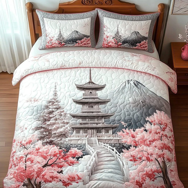 Japanese Blossom Pagoda quilted 3-piece bedding set on a made bed with two matching pillow shams