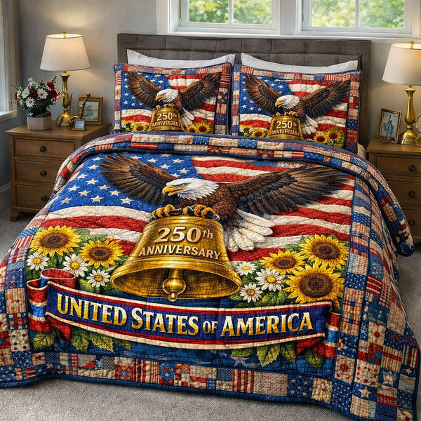 Liberty Legacy quilted 3-piece bedding set on a made bed in a warmly lit bedroom