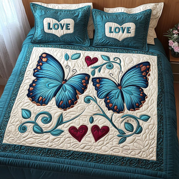 Light as a Feather Love quilted 3-piece bedding set on a made bed with two matching pillow shams