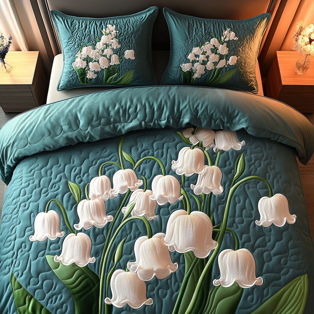 Lily Bouquet quilted 3-piece bedding set on a made bed with two matching pillow shams