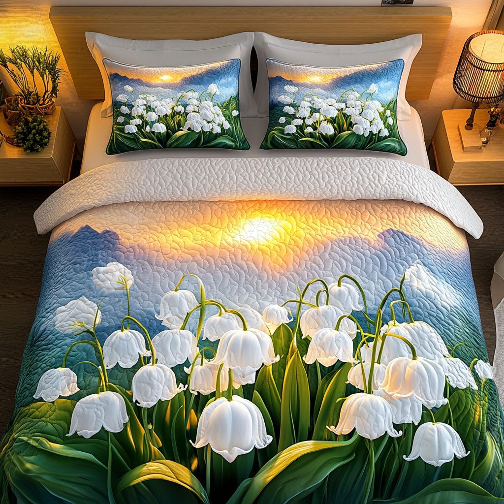 Lily Glow quilted 3-piece bedding set on a made bed with two matching pillow shams