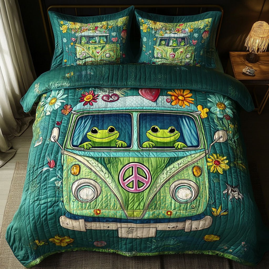 Love Bug Frogs quilted 3-piece bedding set on a made bed with two matching pillow shams