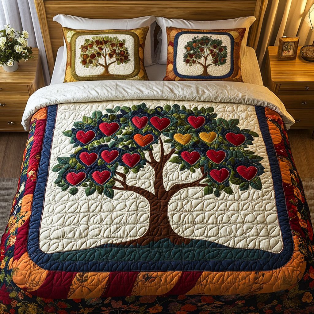 Love Canopy quilted 3-piece bedding set on a made bed with two matching pillow shams