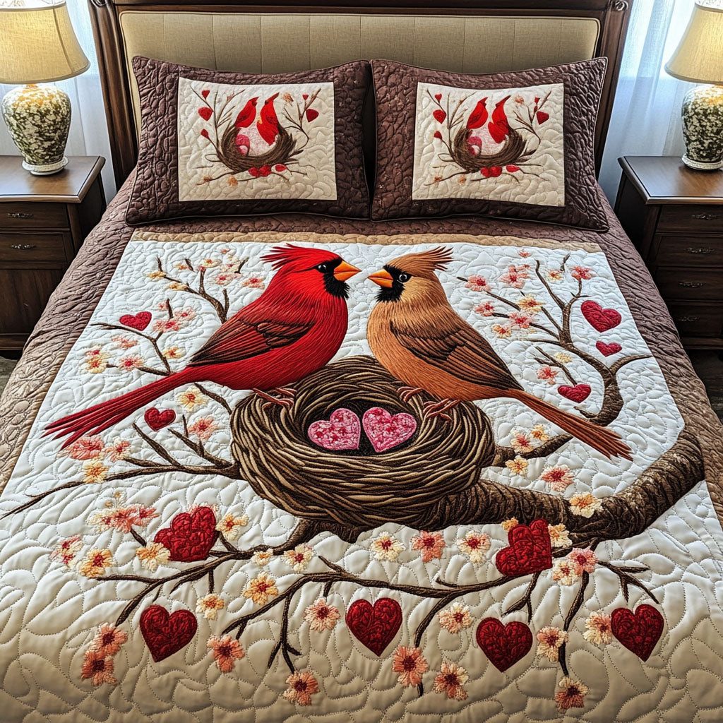 Love Perch quilted 3-piece bedding set on a made bed with two matching pillow shams