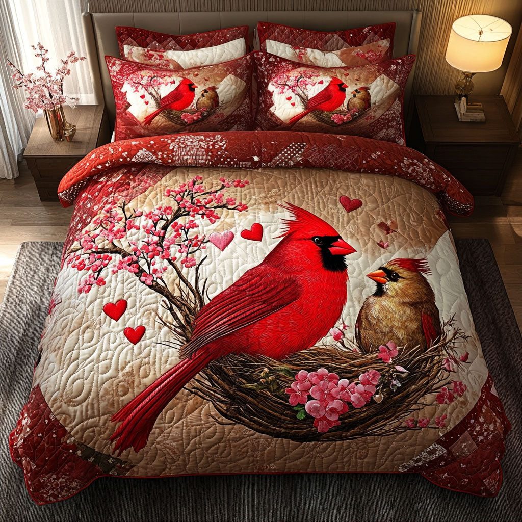 Love Perch quilted 3-piece bedding set on a made bed with two matching pillow shams