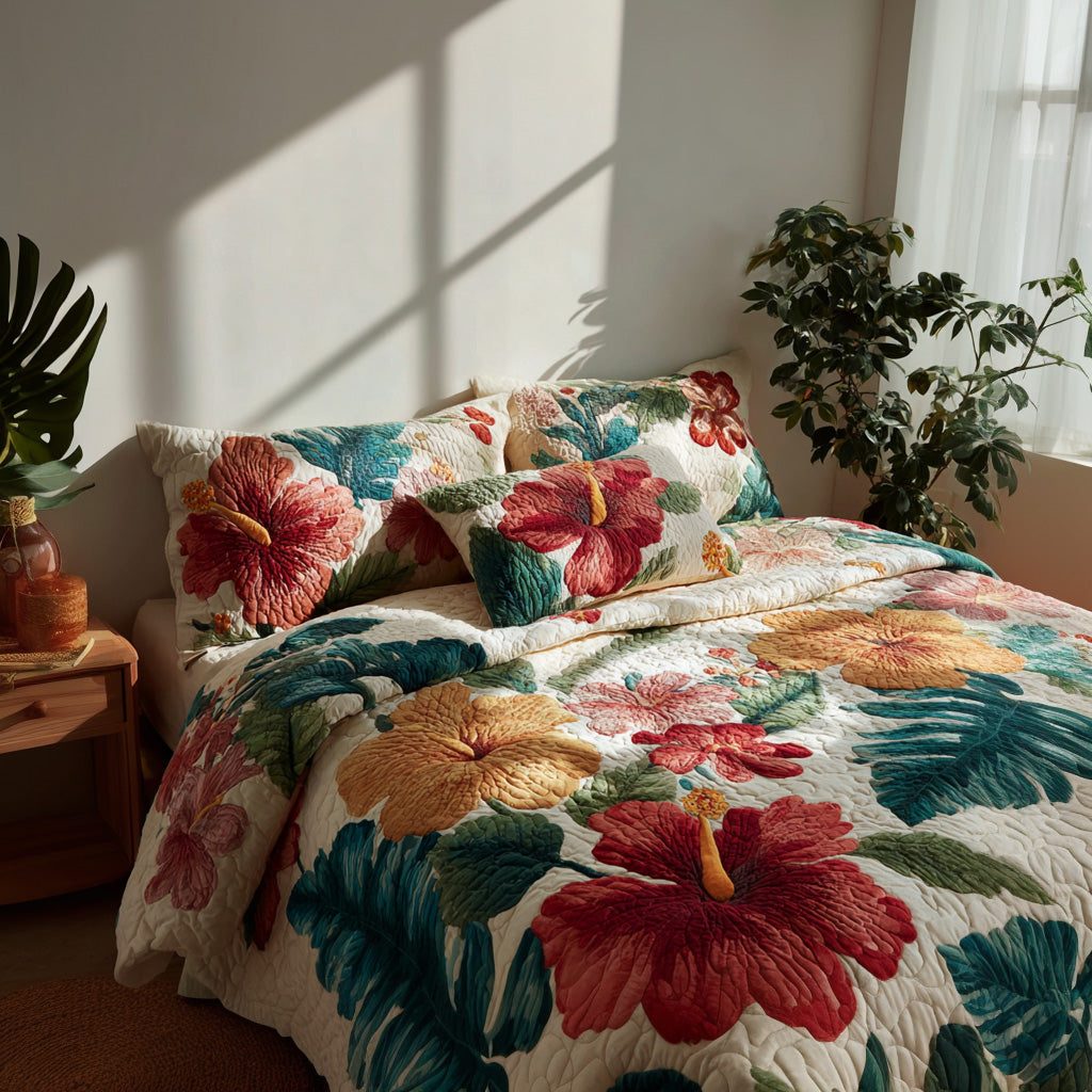 Lush Hibiscus quilted 3-piece bedding set on a made bed with two matching pillow shams