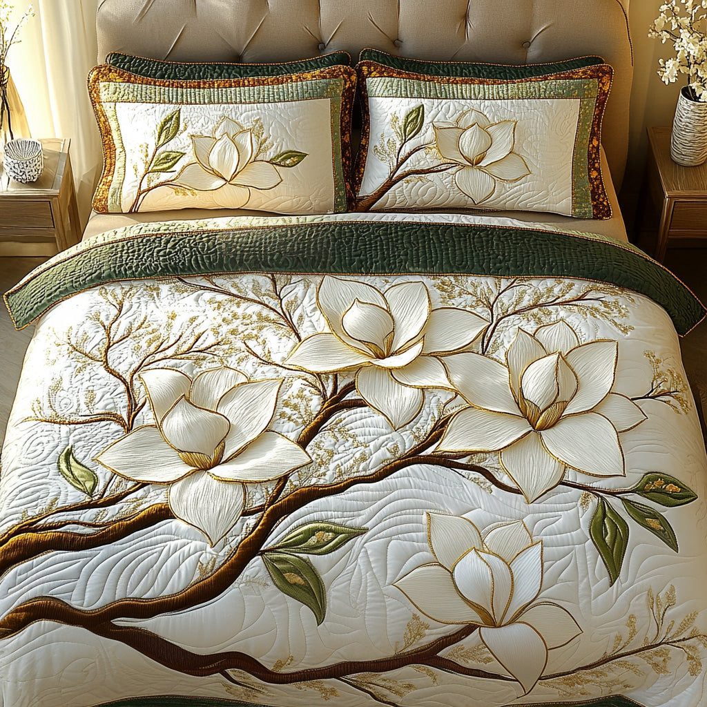 Magnolia Blossom quilted 3-piece bedding set on a made bed with two matching pillow shams