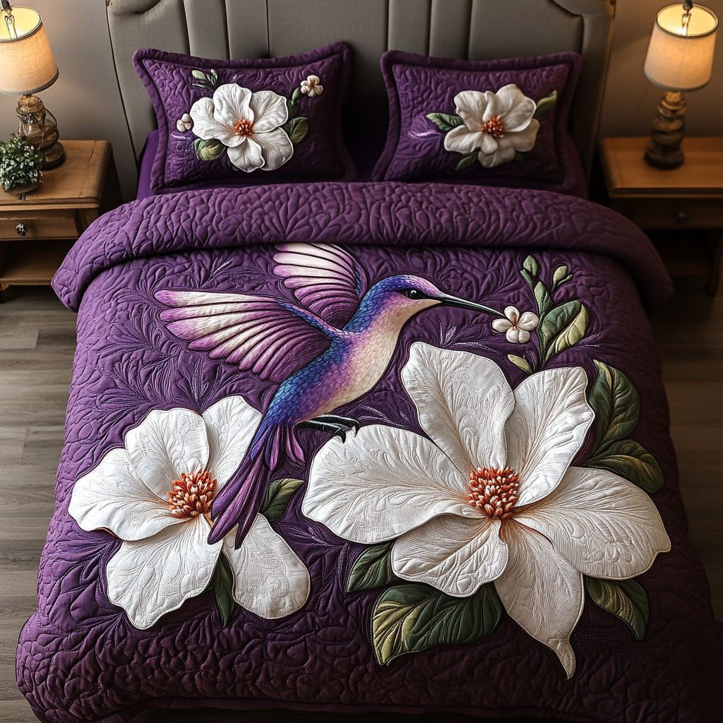 Magnolia Dream quilted 3-piece bedding set on a made bed with two matching pillow shams