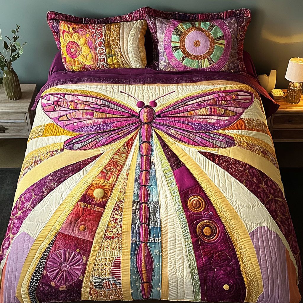 Majestic Glide quilted 3-piece bedding set on a made bed with two matching pillow shams