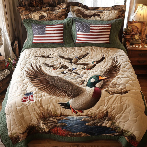 Mallard Ducks Chase quilted 3-piece bedding set on a made bed with two matching pillow shams