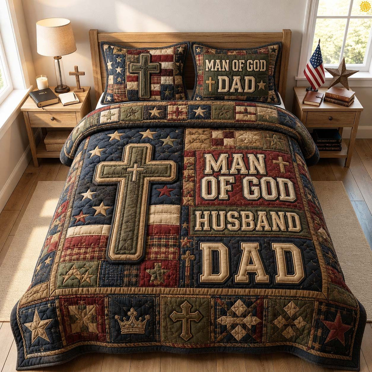 Man Of God Dad quilted 3-piece bedding set on a made bed in a softly lit bedroom