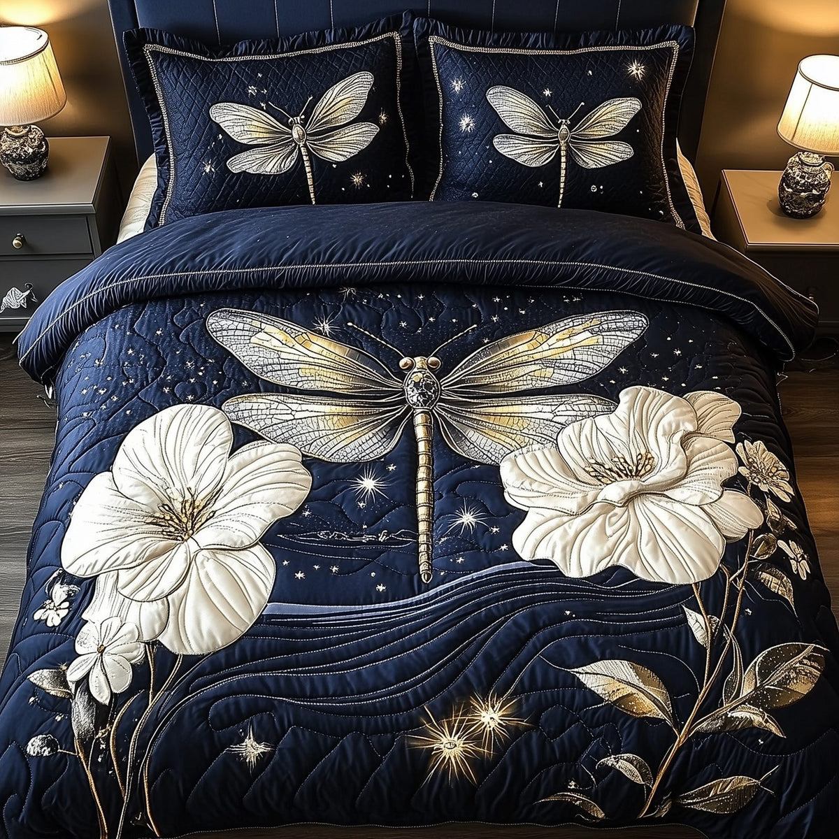 Midnight Dragonfly quilted 3-piece bedding set on a made bed with two matching pillow shams