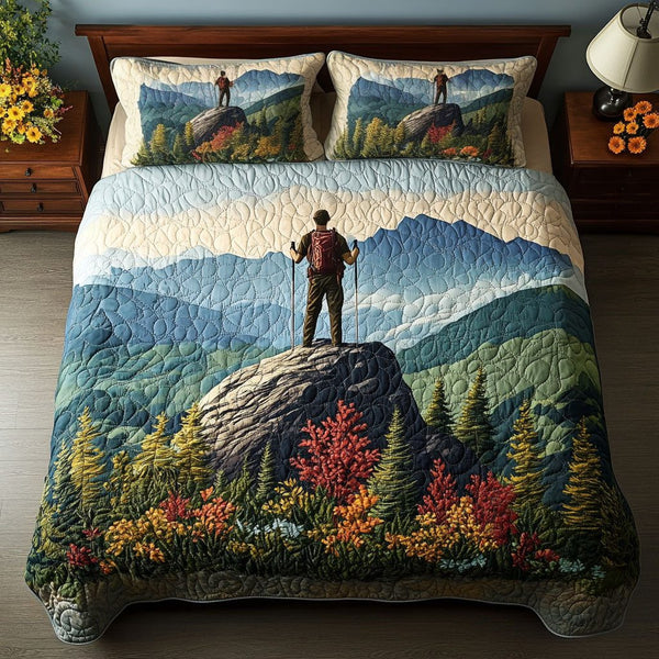 Misty Peak Path quilted 3-piece bedding set on a made bed with two matching pillow shams