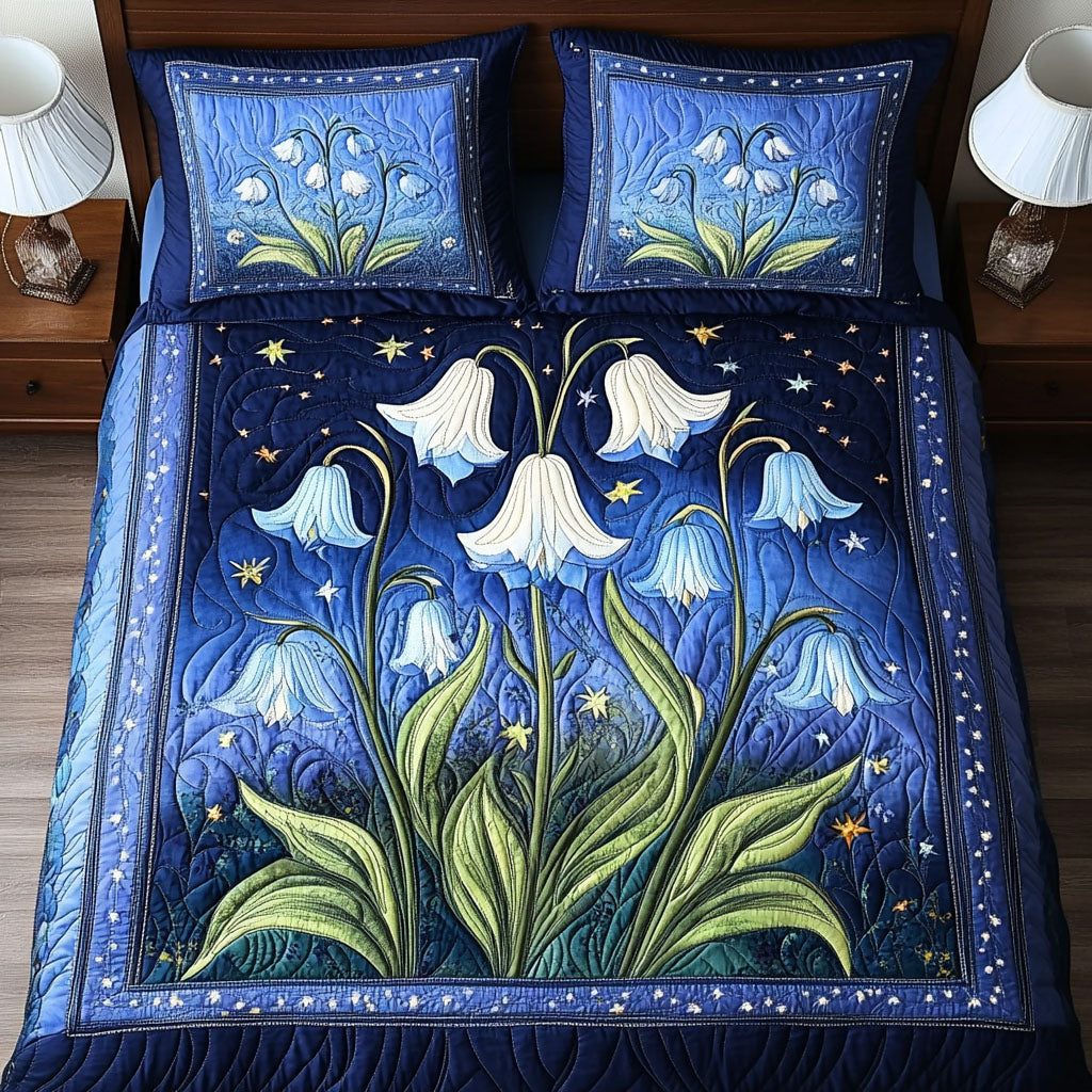 Moonlit Flowers quilted 3-piece bedding set on a made bed with two matching pillow shams