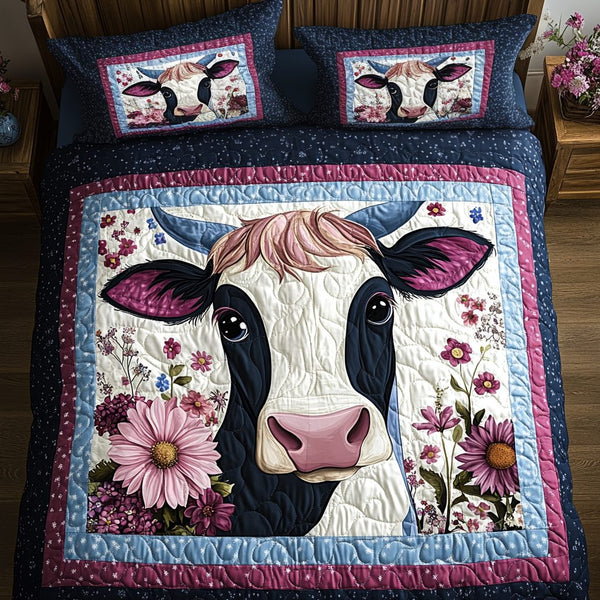 Mootiful Dreams quilted 3-piece bedding set on a made bed with two matching pillow shams