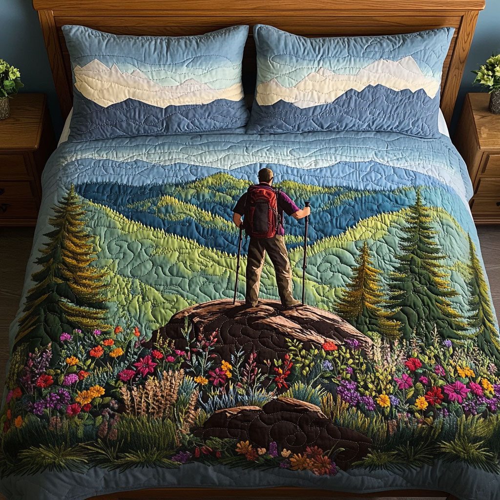 Mountain Expedition quilted 3-piece bedding set on a made bed with two matching pillow shams