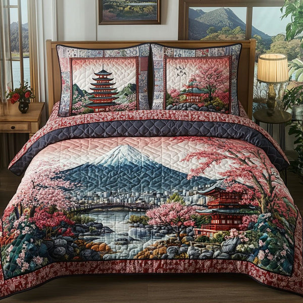 Mountain Serenity quilted 3-piece bedding set on a made bed with two matching pillow shams