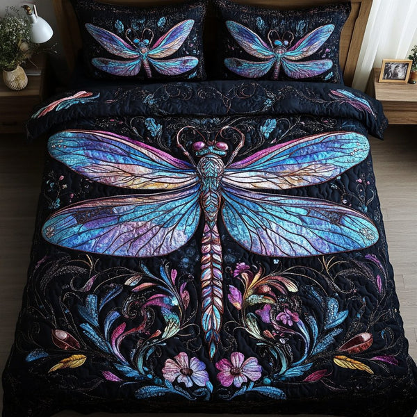 Mystic Dragonfly quilted 3-piece bedding set on a made bed with two matching pillow shams