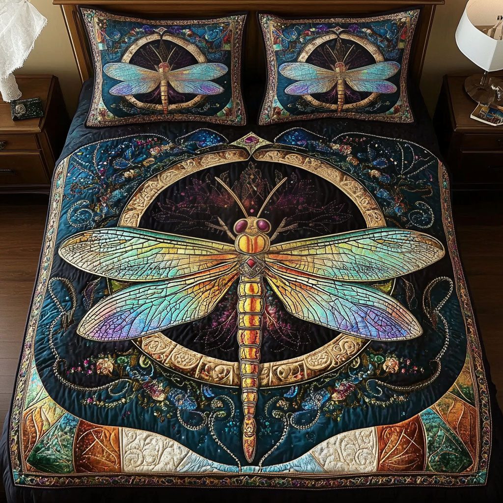 Mystic Dragonfly quilted 3-piece bedding set on a made bed with two matching pillow shams