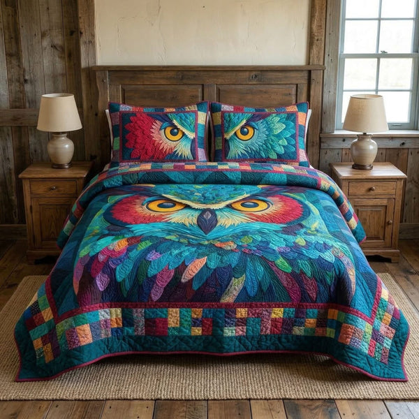 Mystic Feathers quilted 3-piece bedding set on a made bed with two matching pillow shams