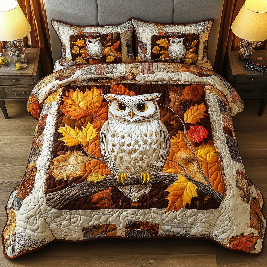 Mystic Feathers quilted 3-piece bedding set on a made bed with two matching pillow shams
