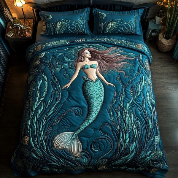 Mystic Mermaid quilted 3-piece bedding set on a made bed in a light coastal bedroom