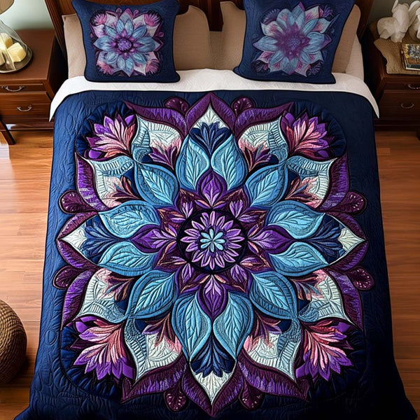 Mystic Petals quilted 3-piece bedding set on a made bed with two matching pillow shams