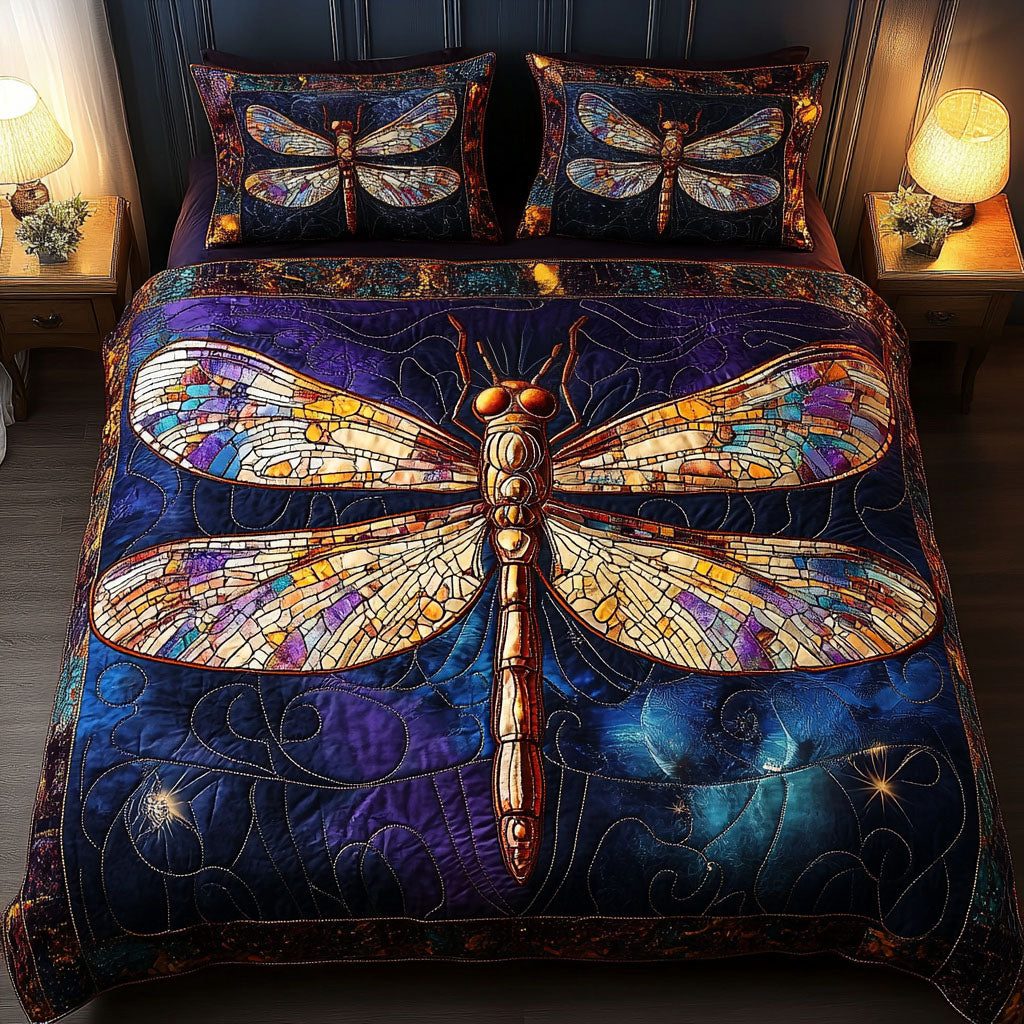Night Mosaic quilted 3-piece bedding set on a made bed with two matching pillow shams